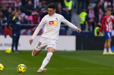 Madrid, Spain - December 13, 2025: League match between Atletico Madrid and Valencia CF played in Madrid. Valencia FC players during the match. EA Sports League.