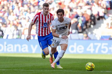 Madrid, İspanya - 13 Aralık 2025: Madrid 'de Atletico Madrid ile Valencia CF arasında oynanan lig maçı. Valencia FC oyuncuları maç sırasında. EA Spor Ligi.