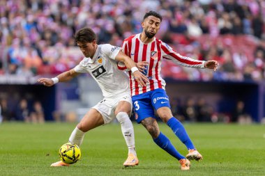 Madrid, Spain - December 13, 2025: League match between Atletico Madrid and Valencia CF played in Madrid. Valencia FC players during the match. EA Sports League.