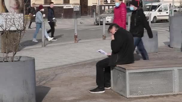 Prague Czech Republic 2021 Man Sitting Bench Reading Magazine While — Stock Video