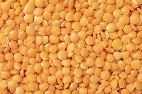 トップビュー オレンジレンズ豆の閉鎖 料理の背景 — ストック写真