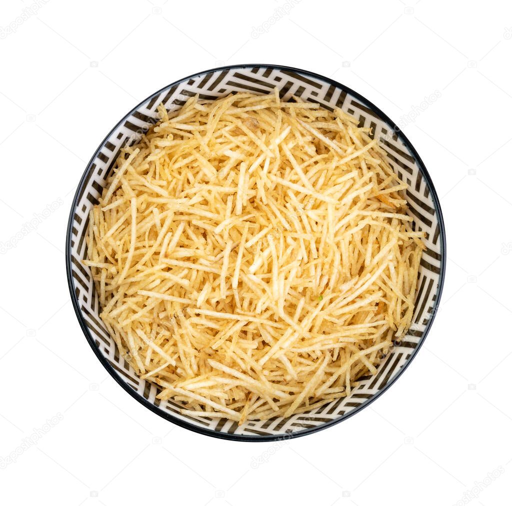 Potato straw or shoestring potato in a bowl isolated over white background.