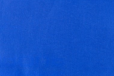Örülmemiş mavi kumaşa yakın çekim.