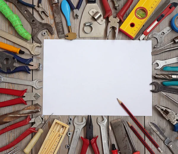 Tools on a wooden floor, top view — Stock Photo, Image