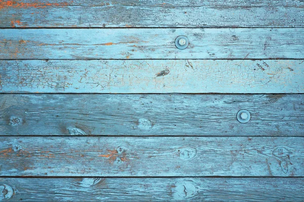 Achtergrond van blauwe plankjes met verf peeling. — Stockfoto