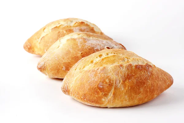 Three French loaf on a white background (not isolate). — Stock Photo, Image