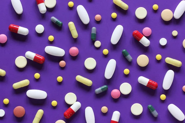 Colorful Pills Capsules Purple Background Medical Backdrop Flat Lay — Stock Photo, Image