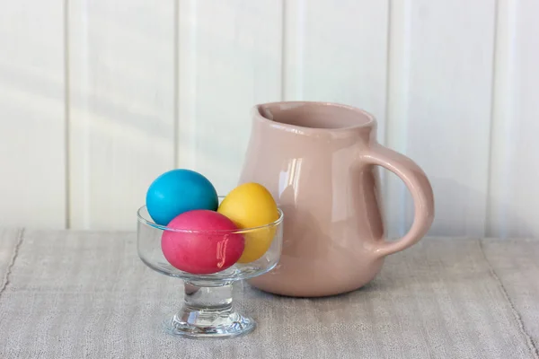 Easter Composition Three Colorful Eggs Jug Table Christian Tradition — Φωτογραφία Αρχείου