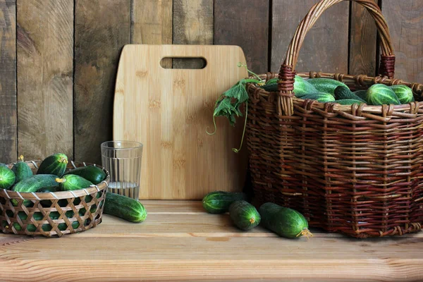 Composition Green Cucumbers Cutting Board Wooden Table Food Vegetables Basket — Stock Photo, Image