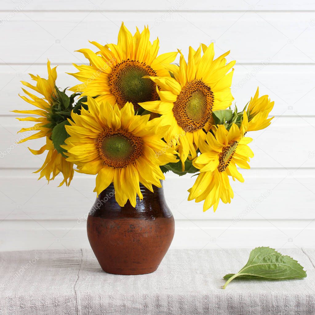 bouquet of yellow sunflowers on the table a light rustic interior