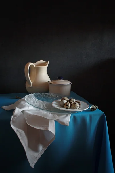 Still life with a white jug and quail eggs — Stock Photo, Image