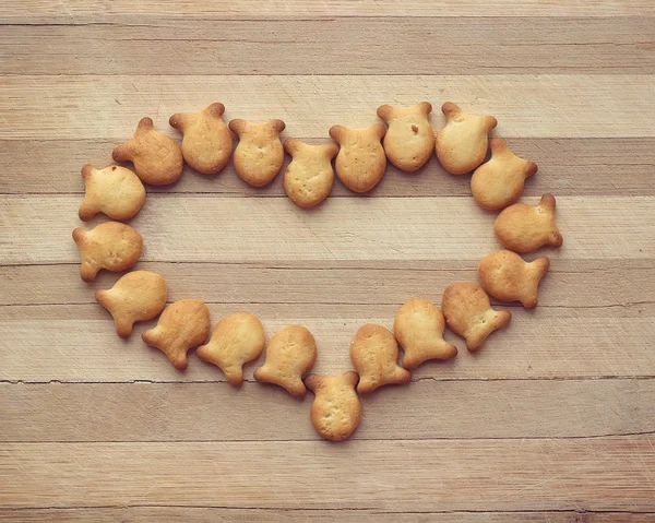 Cookies in the form of small fishes on a board in a strip — Stock Photo, Image