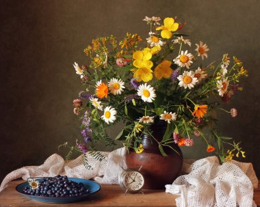 Still life with a bouquet of summer flowers.