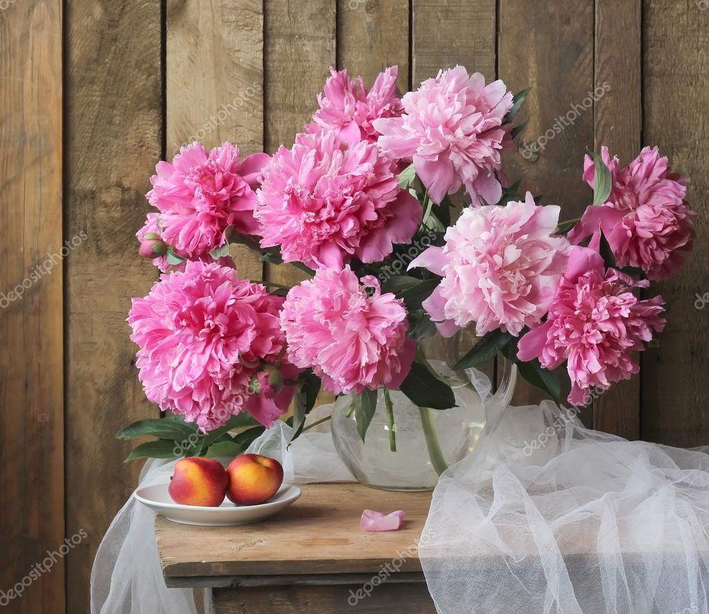 Still life with a bouquet of peonies. — Stock Photo © BalaguR #77148111