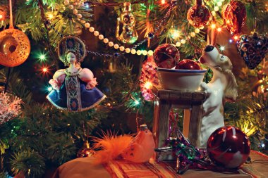 New Year's toys against the decorated Christmas tree