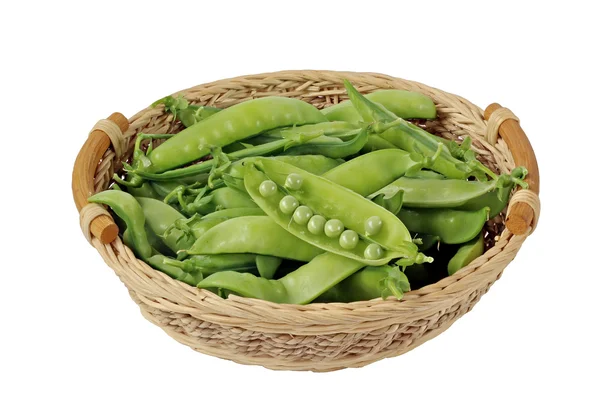 Pods of green peas in a basket on a white background, isolate. — Stock Photo, Image