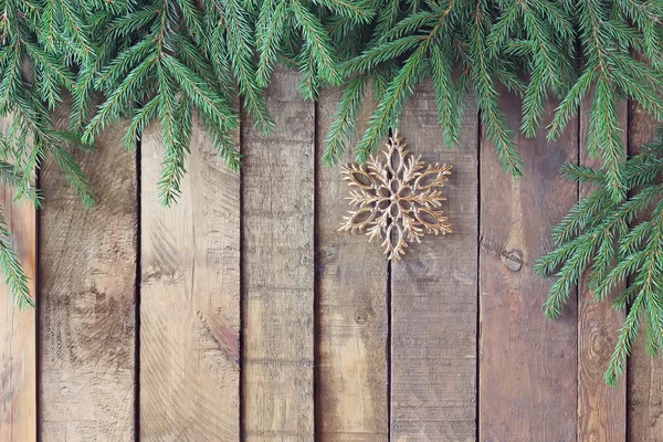 Background from boards with fir-tree branches from above — Stock Photo, Image