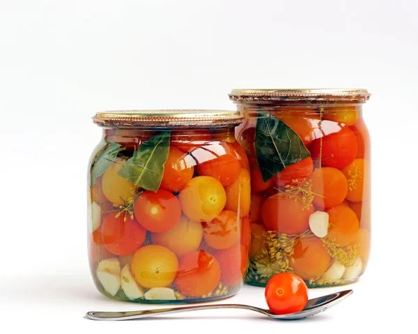 Tinned cherry tomatoes in glass jars — Stock Photo, Image