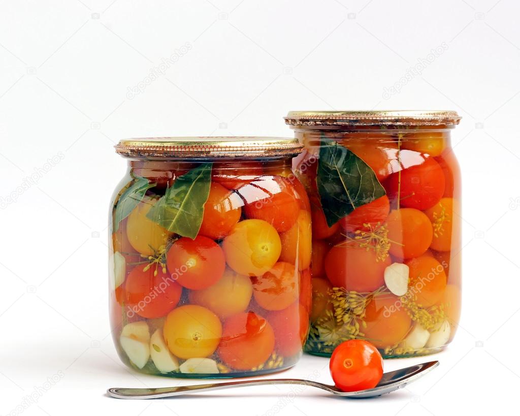 Tinned cherry tomatoes in glass jars 