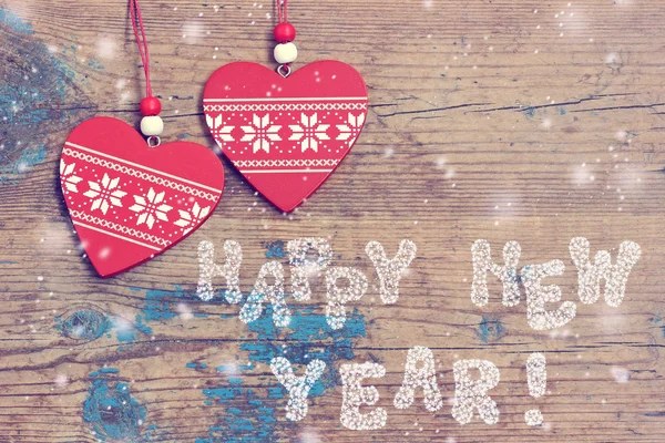 New Year's bakgrund med röda dekorativa smycken — Stockfoto
