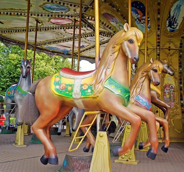 Big roundabout with horses in the square. — Stock Photo, Image