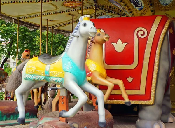 Big roundabout with horses in the square. — Stock Photo, Image