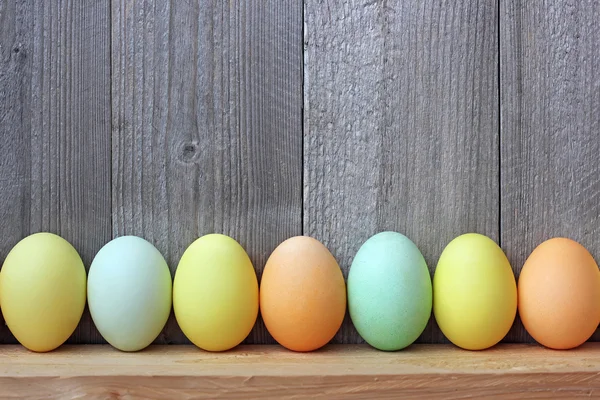 Color Easter eggs against boards. — Stock Photo, Image