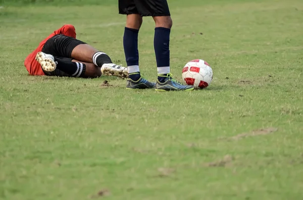 Soccer goalkeeper laying down — Stock Photo, Image
