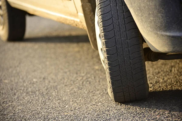 Close-up image of car wheel, rubber tire