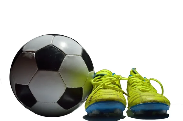 Soccer shoes and a football — Zdjęcie stockowe