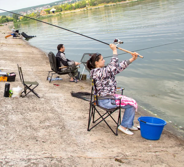 Girl with a fishing rod — Stock Photo, Image