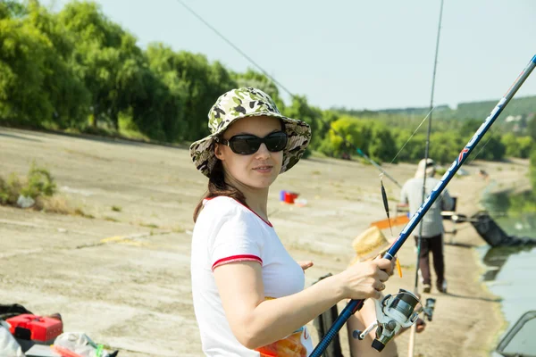 Girl with a fishing rod — Stock Photo, Image