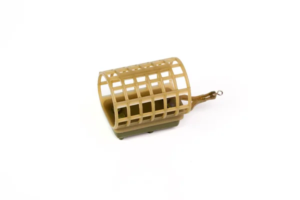 Fishing feeder and reel with accessories on white background Stock