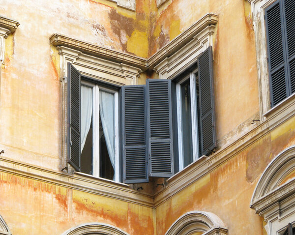 Diptych of Rome windows in orange house