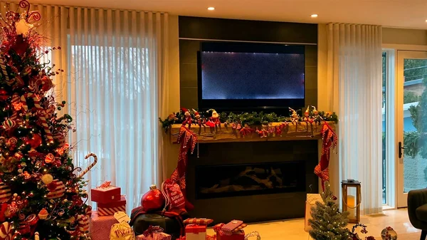 Christmas scene with gifts and tv in the background 3