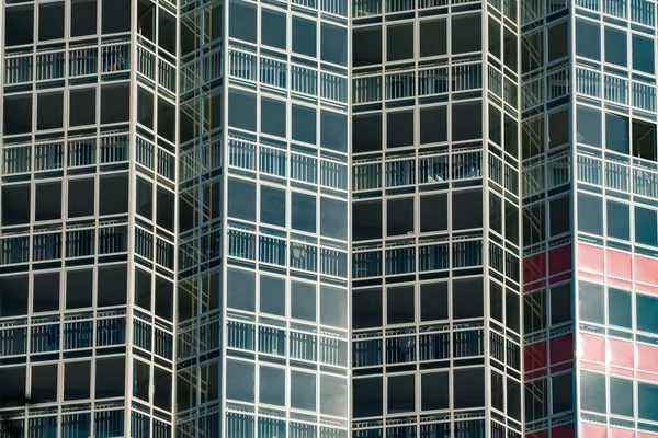 Multistorey building with transparent windows texture background.
