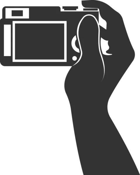 Icona della fotocamera piatta in mano. Illustrazione vettoriale. — Vettoriale Stock