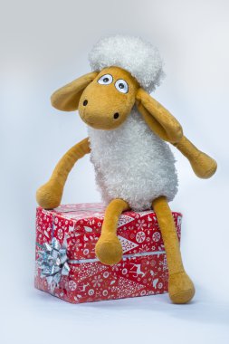 Sheep with a Christmas gift clipart