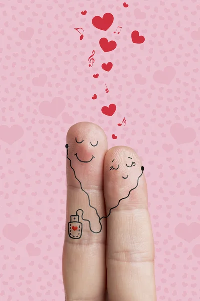 Happy Valentine 's Day Themenreihe. Fingerkunst eines glücklichen Paares. Liebhaber umarmen und hören Musik. Archivbild — Stockfoto