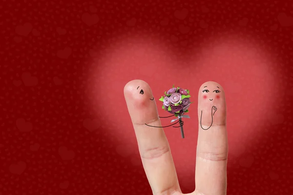 Una feliz pareja enamorada de sonriente pintada. El hombre está dando flores. Feliz San Valentín tema de la serie. Imagen de stock —  Fotos de Stock