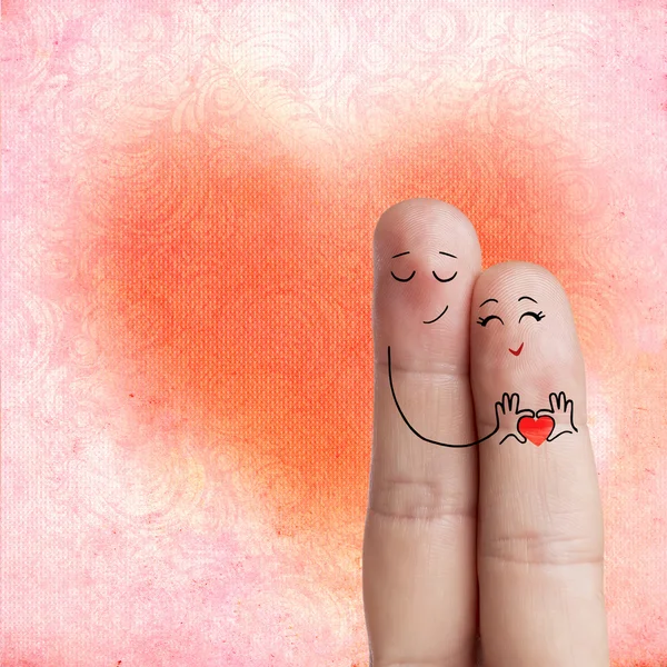 Finger art. Gli amanti stanno abbracciando e tenendo il cuore rosso. Immagine stock — Foto Stock