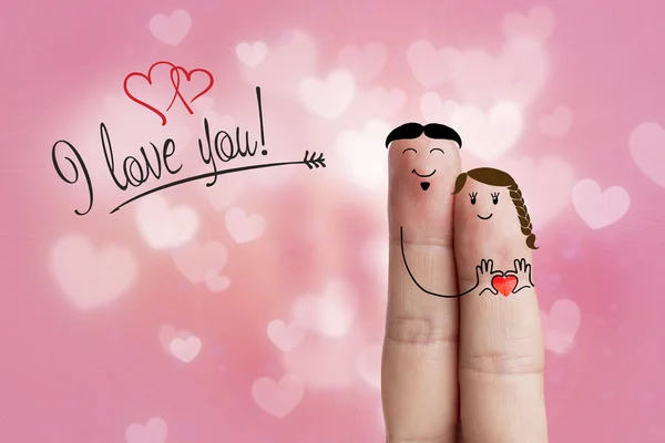 Arte de dedos. Los amantes están abrazando y sosteniendo el corazón rojo. Imagen de stock —  Fotos de Stock