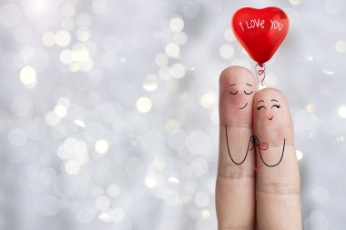 Parmak sanat. Aşık kucaklayan ve kırmızı balon tutuyor. Stok görüntü