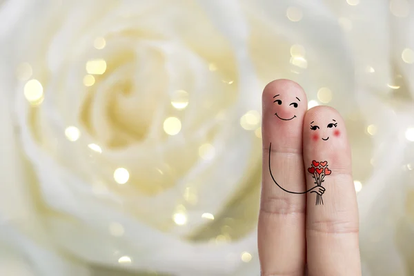 Finger art of a Happy couple. Man is giving bouquet. Stock Image — Stock Photo, Image