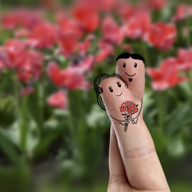 Finger art of a Happy couple. Man is giving bouquet. Stock Image clipart
