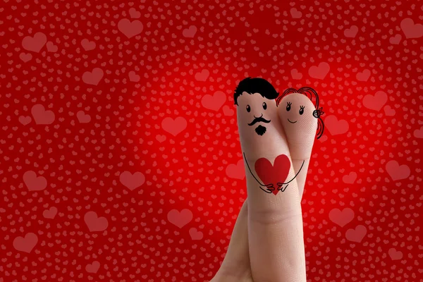 Finger art. Hipster lovers is embracing and holding red heart. Stock Image — Stock Photo, Image