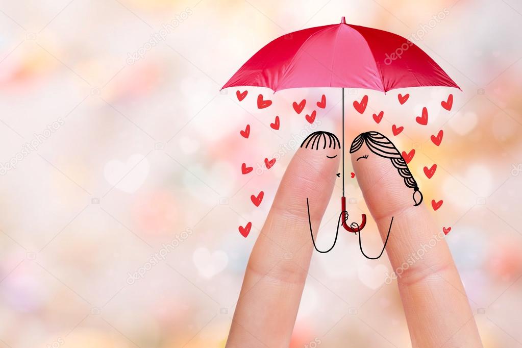 Conceptual finger art of a Happy couple. Lovers are kissing. Stock Image