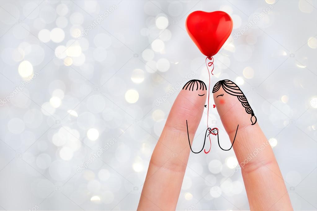 Conceptual finger art of a Happy couple. Lovers are kissing. Stock Image