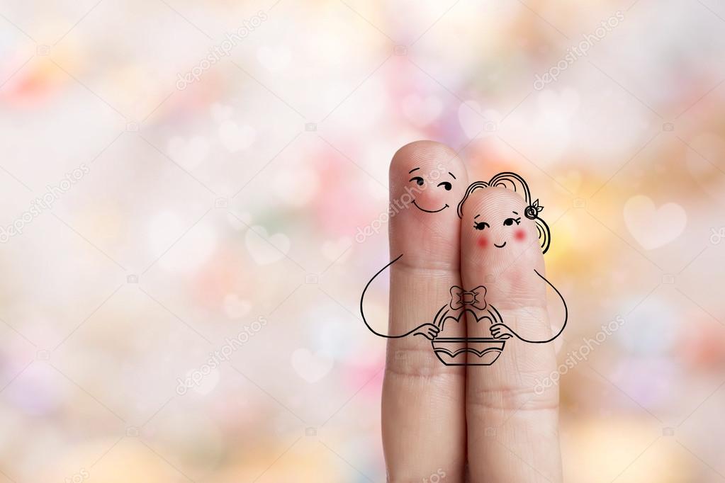 Conceptual Easter Finger Art. Couple Are Holding Basket With Painted Eggs. Stock Image