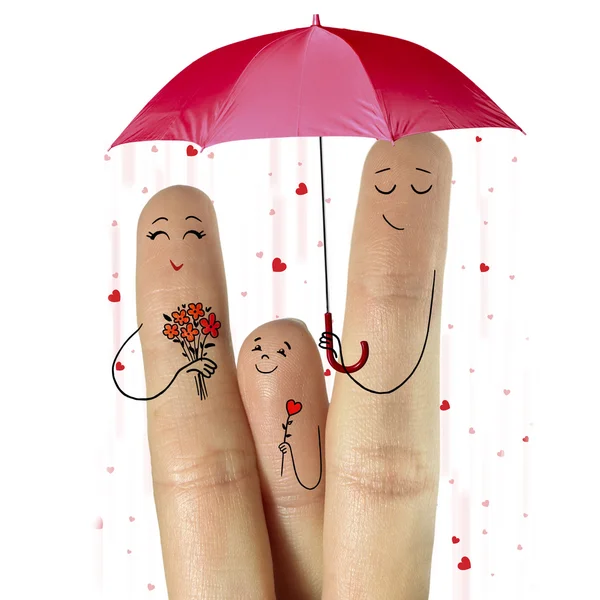 Father, and son are giving flowers their mother staying under umbrella with falling hearts — Stock Photo, Image